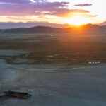 Sunrise over the mountains of western Mongolia, with a traditional winter residence in the foreground and the yurts of our first eagle-hunter family visible in the distance (image by Ingrid Koedood)