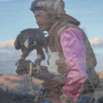 A double-exposure portrait of a young eagle hunter, his face merging with the landscape that shapes his life (image by Ingrid Koedood)