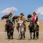 Three young eagle hunters competing at the Eagle Hunters festival (image by Ingrid Koedood)