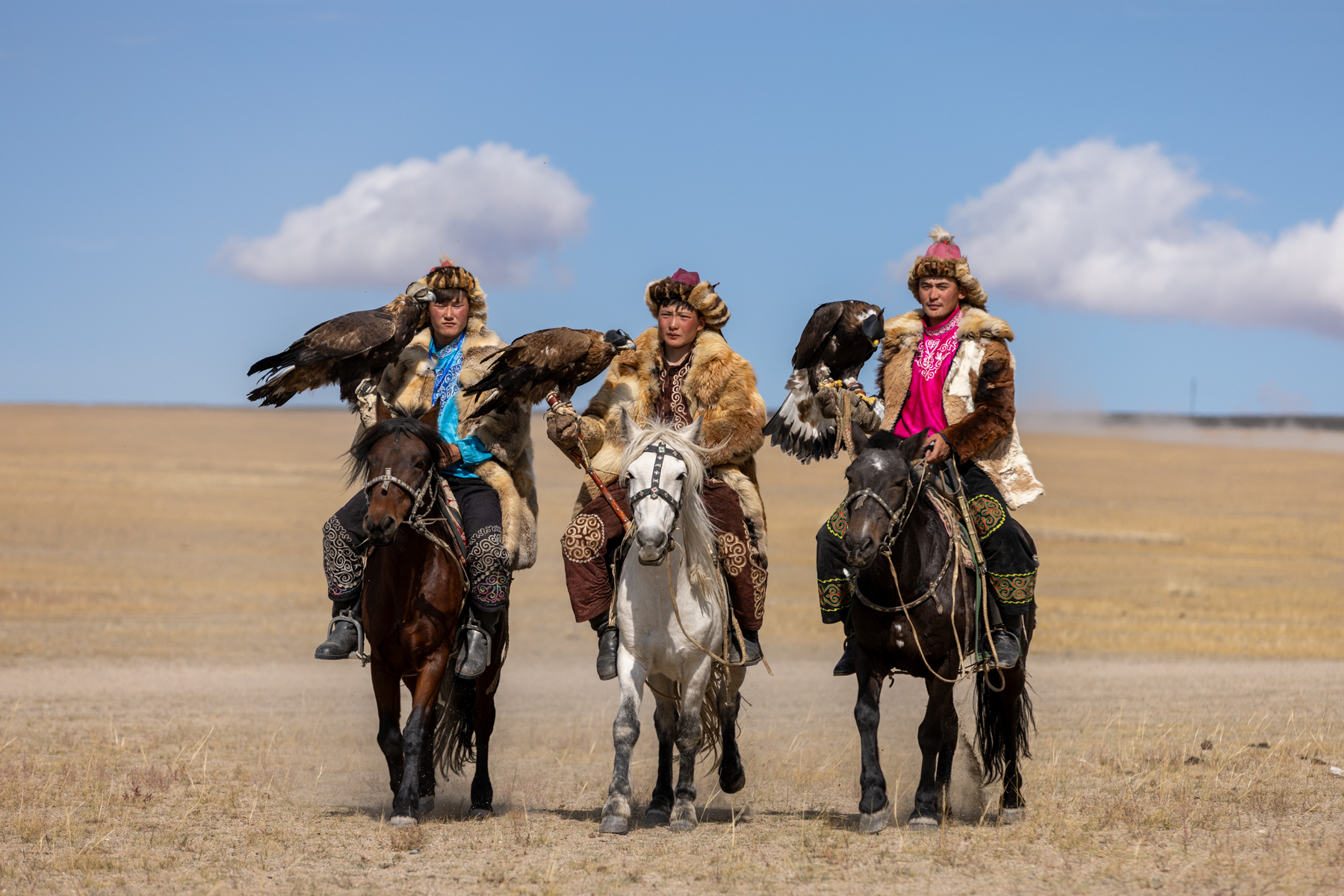 Three young eagle hunters competing at the Eagle Hunters festival (image by Ingrid Koedood)