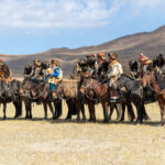 Eagle hunter and their eagles waiting for their turn to compete at the Eagle Hunters festival (image by Ingrid Koedood)