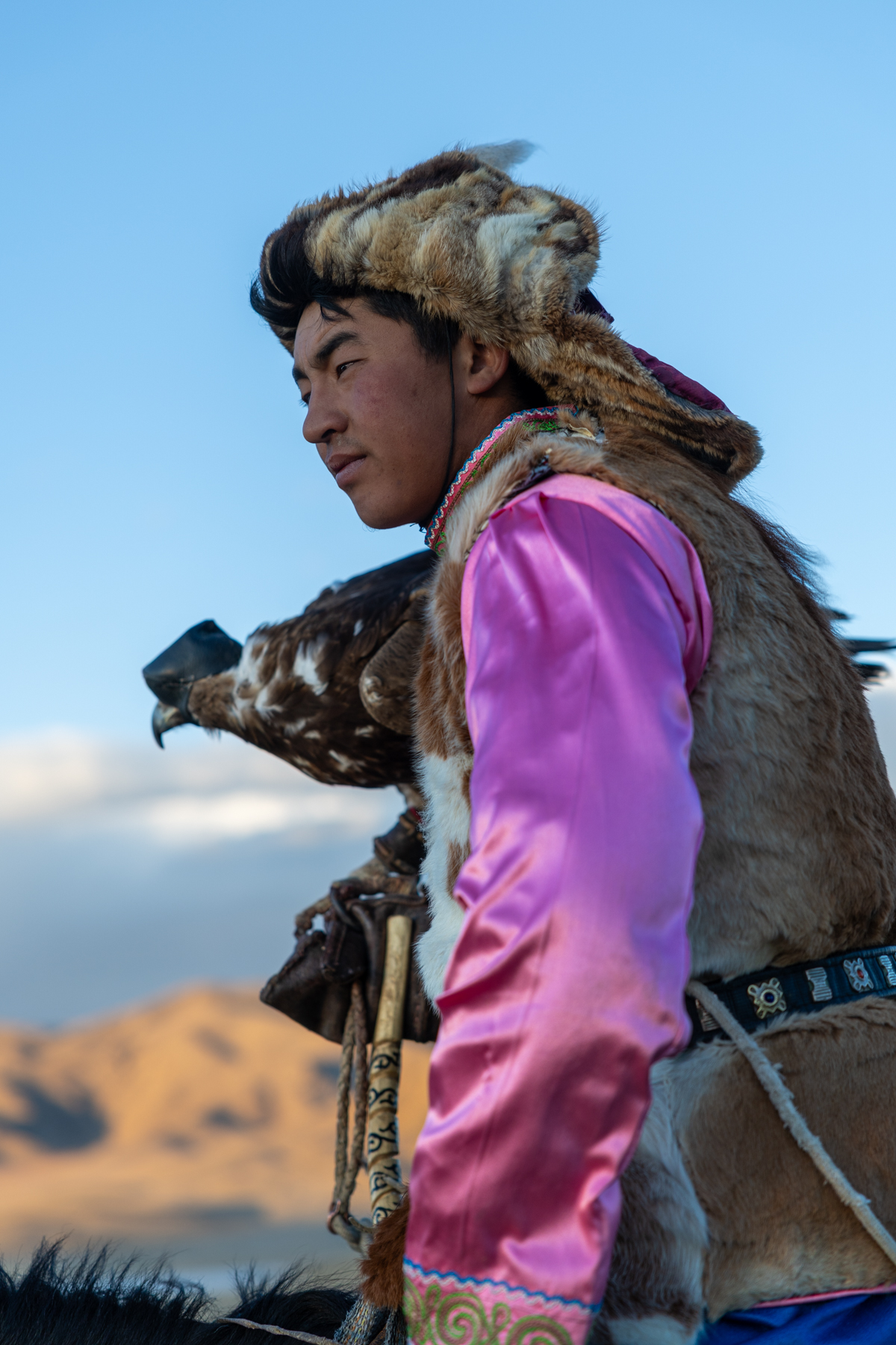 Portrait of Tilekjan with is two-year-old Golden Eagle (image by Ingrid Koedood)