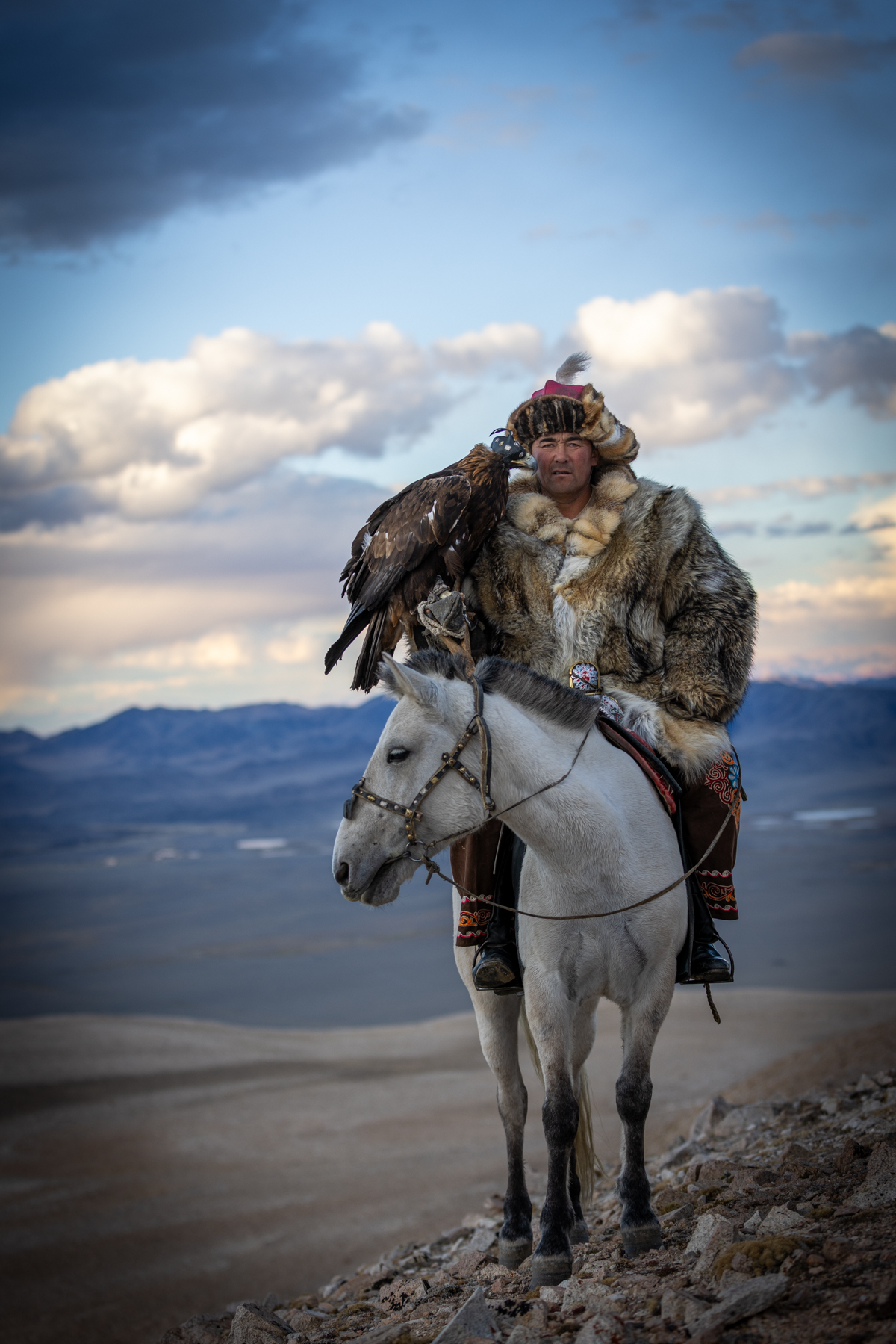 In the mountains, Baurjan poses with his eagle and horse (image by Ingrid Koedood)