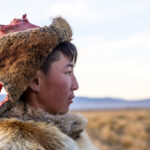 A young eagle hunter in the early morning, photographed during our stay with our second eagle hunter family (image by Ingrid Koedood)