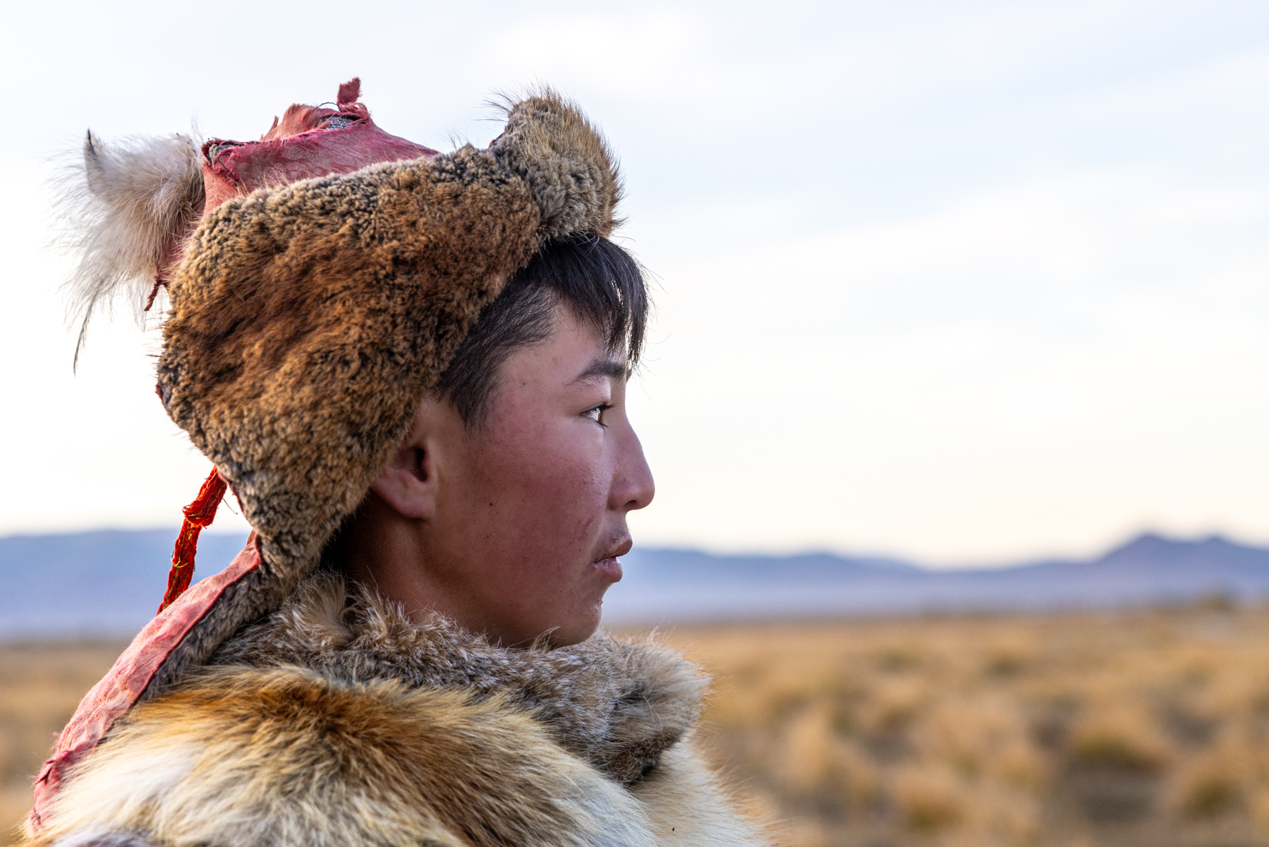 A young eagle hunter in the early morning, photographed during our stay with our second eagle hunter family (image by Ingrid Koedood)