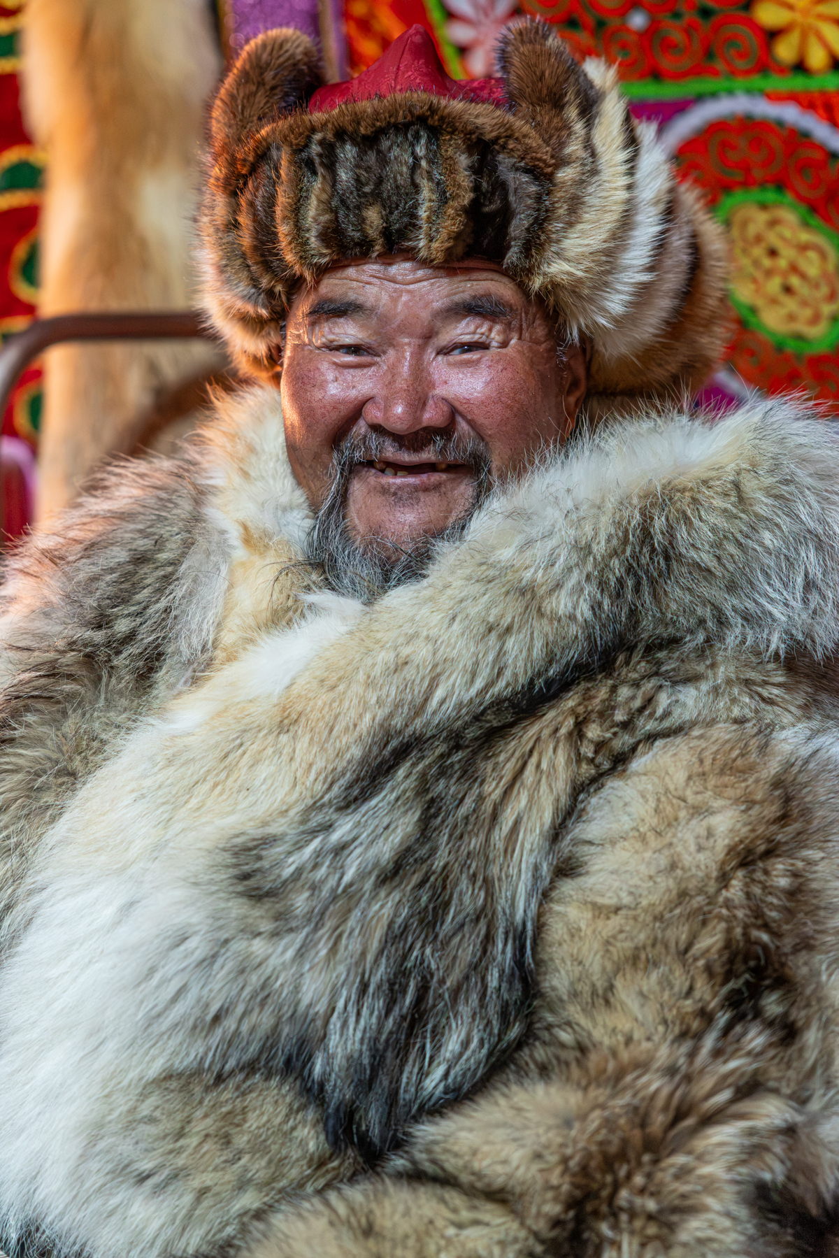 Portrait of a Mongolian herder whose family we visited during our journey. The family raises Bactrian camels and invited us into their home to photograph their daily life (image by Ingrid Koedood)