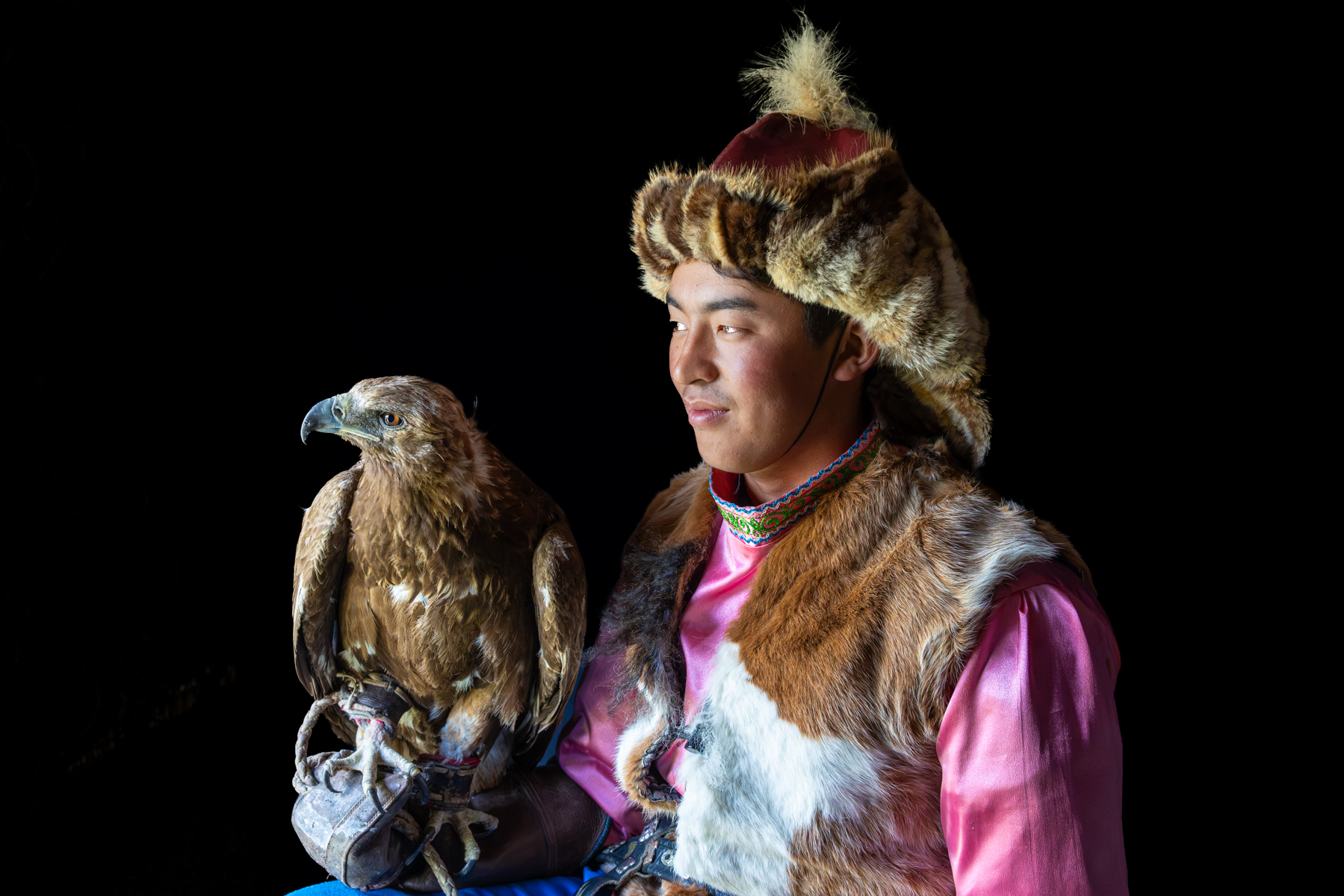 Tilekjan and his golden eagle during a portrait session inside the family yurt where we were staying (image by Ingrid Koedood)