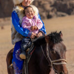 Horse riding starts young. Aymoldir shares her horse with her little sister, growing up with a way of life that is passed down from one generation to the next (image by Ingrid Koedood)