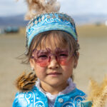 A young girl dressed in her finest traditional clothes for the Eagle Hunters festival (image by Ingrid Koedood)