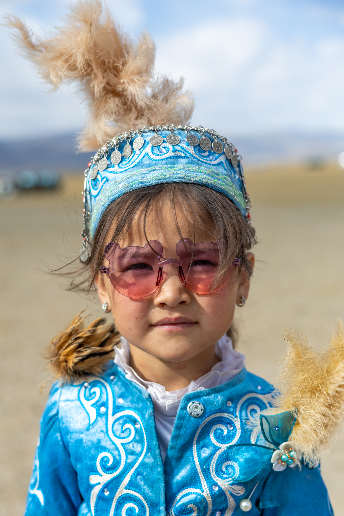 A young girl dressed in her finest traditional clothes for the Eagle Hunters festival (image by Ingrid Koedood)