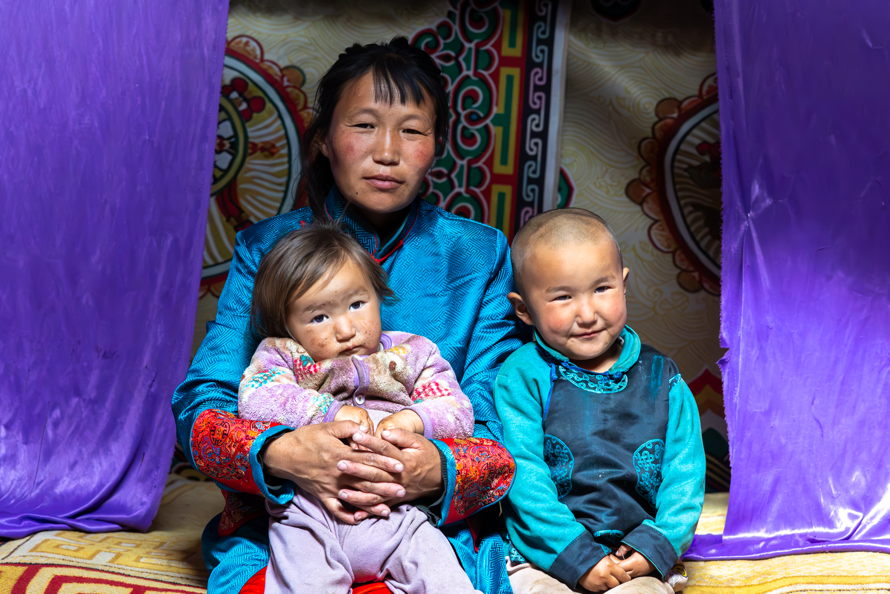 We were welcomed into the family’s yurt, where the mother and her children posed for our cameras (image by Ingrid Koedood)