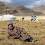 Morning life with a Kazakh family: while the women were busy milking the livestock, he took the opportunity to relax in the sun (image by Ingrid Koedood)