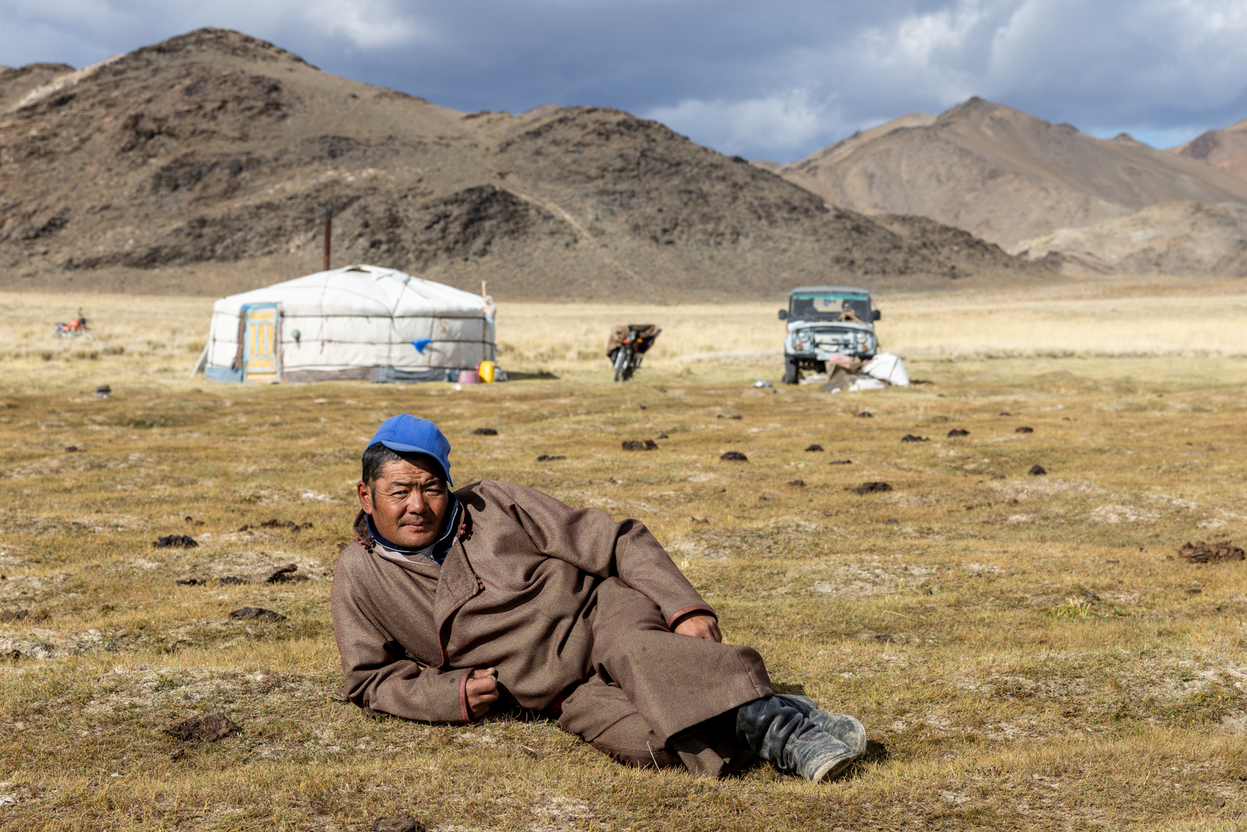 Morning life with a Kazakh family: while the women were busy milking the livestock, he took the opportunity to relax in the sun (image by Ingrid Koedood)