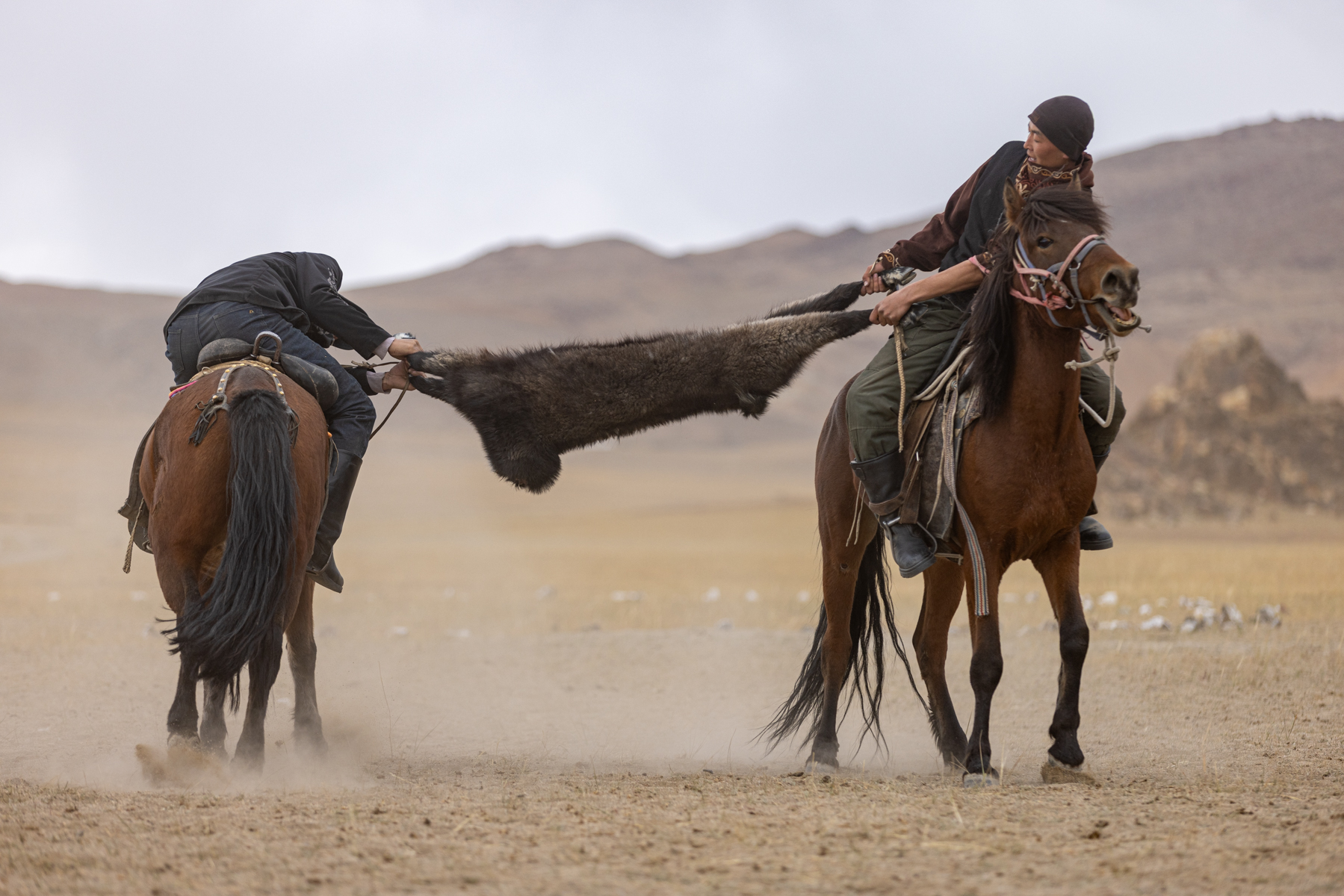 Kokbar, the mounted horseback tug-of-war using the headless carcass of a goat (image by Ingrid Koedood)