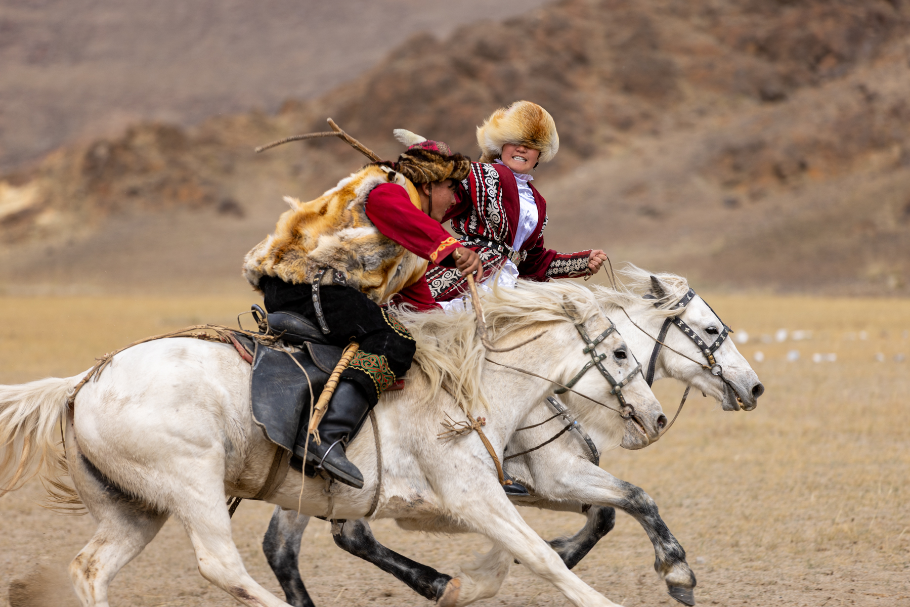 Kuzkuar, a traditional horseback chasing game between a man and a woman (image by Ingrid Koedood)