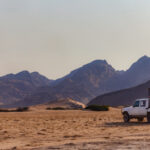 For me, the Hoanib River Valley was my favourite Namibia location. Here, one of our vehicles enjoys the craggy, desolate landscape (image by Virginia Wilde)
