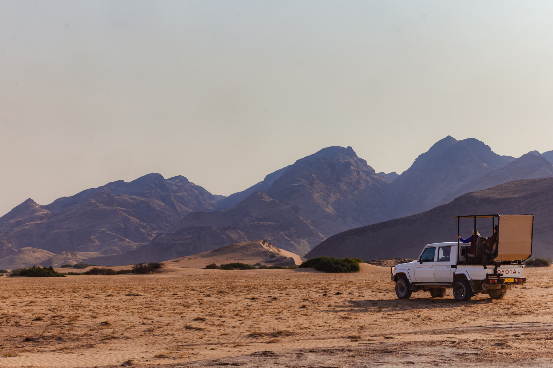 For me, the Hoanib River Valley was my favourite Namibia location. Here, one of our vehicles enjoys the craggy, desolate landscape (image by Virginia Wilde)