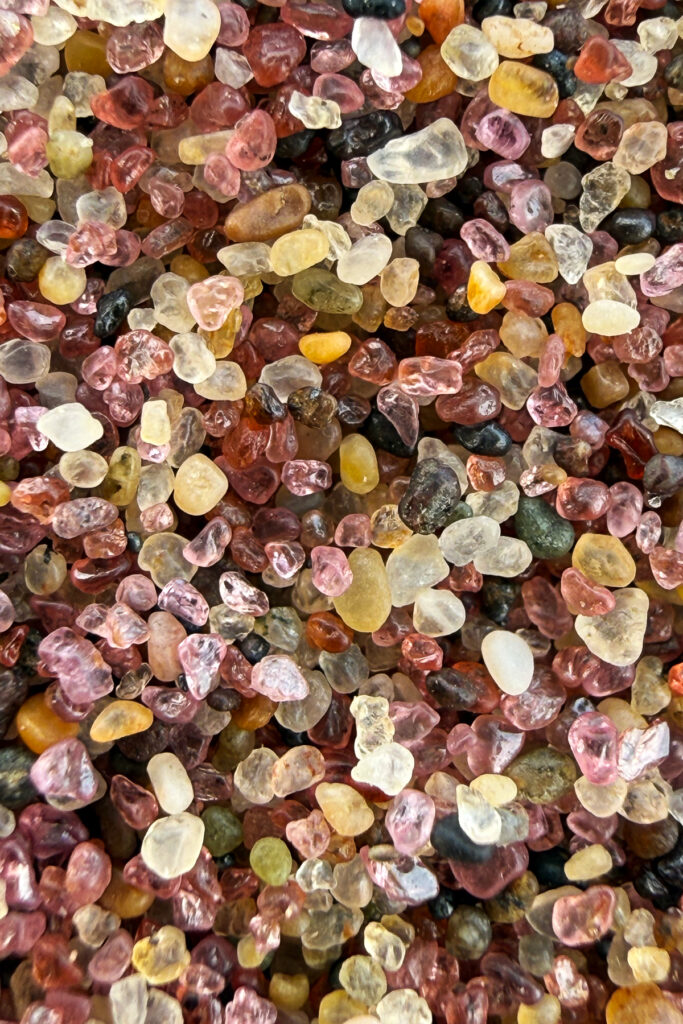A close-up of the Namib: a mosaic of tiny, weather-worn grains in shades of rose, amber, cream and black - each one shaped the desert over countless years (image by Virginia Wilde)
