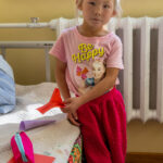 A young girl in the school dormitory, where children from remote families stay because home is too far away to travel to each day (image by Ingrid Koedood)