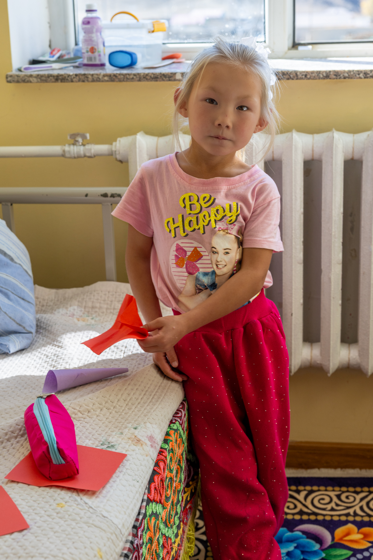 A young girl in the school dormitory, where children from remote families stay because home is too far away to travel to each day (image by Ingrid Koedood)