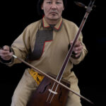 A Mongolian throat singer who stopped by our lunch tent during the Eagle festival to perform for us. Throat singing is a traditional vocal technique in which a singer produces a deep fundamental tone together with higher overtones (image by Ingrid Koedood)