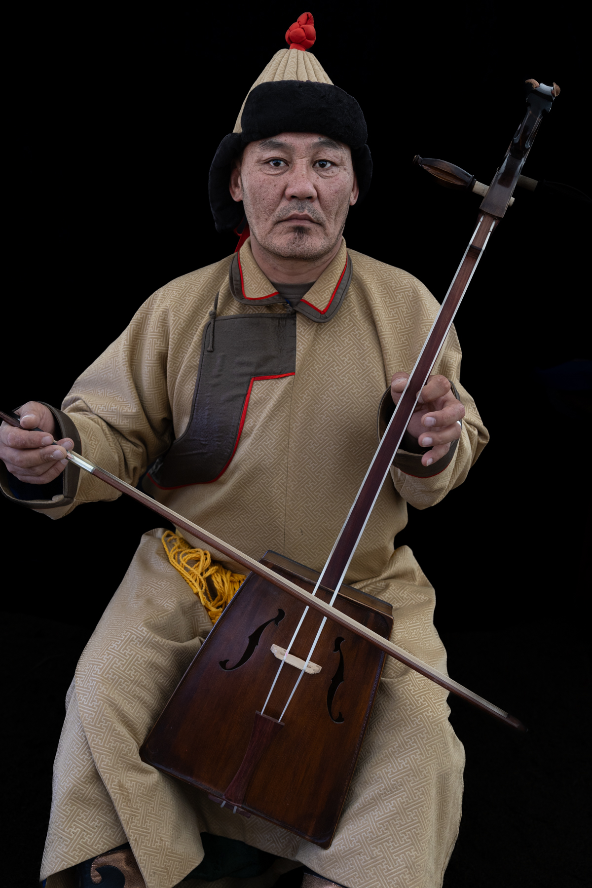 A Mongolian throat singer who stopped by our lunch tent during the Eagle festival to perform for us. Throat singing is a traditional vocal technique in which a singer produces a deep fundamental tone together with higher overtones (image by Ingrid Koedood)