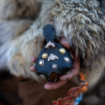A traditional leather Tomaga covers the eagle’s eyes, reducing visual stimulation and keeping the bird calm while resting, travelling or waiting to hunt (image by Ingrid Koedood)