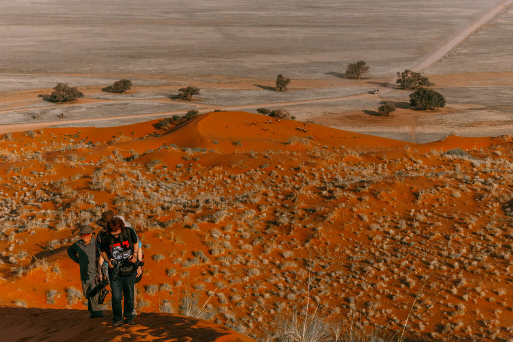 Namibia tour member Esther led the climb up Elim Dune - Sossusvlei's famed sunset spot. We were gifted incredible views but the hike wasn't for the faint-hearted! (image by Virginia Wilde)