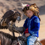 The tradition of eagle hunting is passed down through generations, with children learning from an early age how to ride, handle and care for their golden eagle (image by Ingrid Koedood)