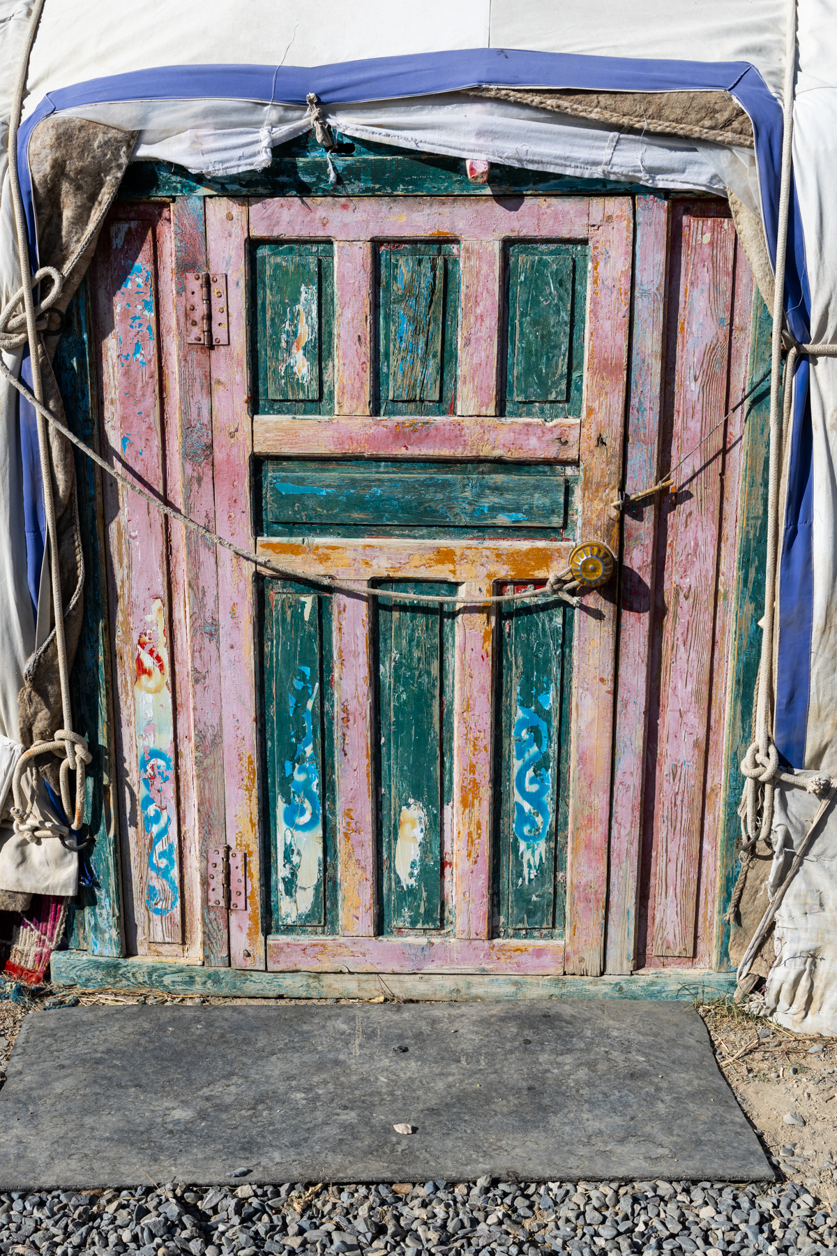 The colourful door of a traditional yurt. When entering, it is important to step over the threshold rather than stand on it. It’s a sign of respect in Mongolian tradition (image by Ingrid Koedood)
